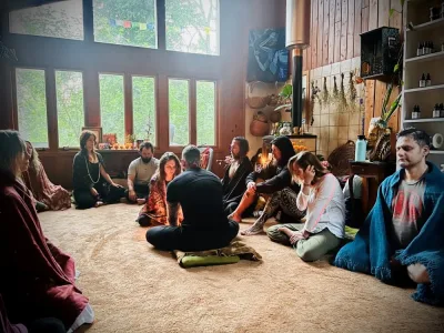 Group of yogis seated on ground meditating
